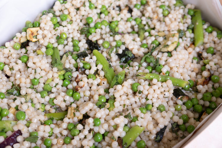 Vegan pea, courgette, asparagus and mint pearl couscous salad by Graze Manchester