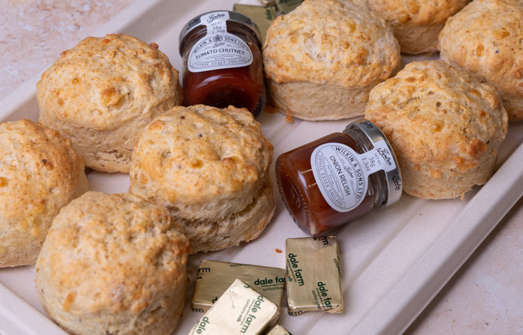 Freshly baked cheese scones with butter and chutney platter by Graze Manchester