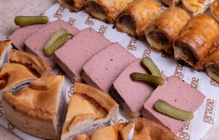 Classic savoury platter with pate pork pie sausage rolls and quiche by Graze Manchester