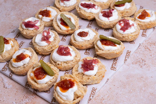 Freshly baked cheese scones topped with whipped feta caramelised onion and spicy tomato chutney