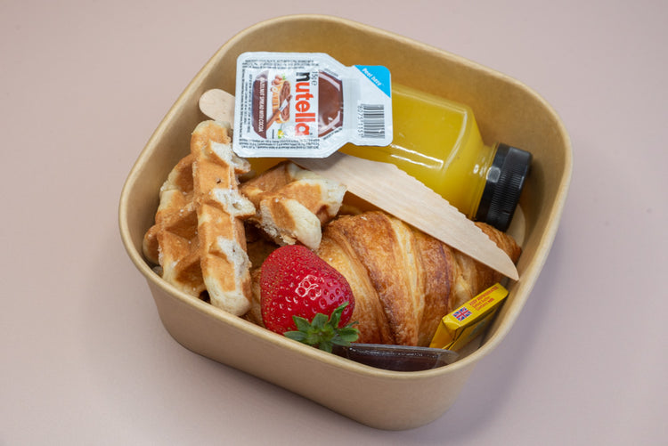Individual brunch box with croissant, waffle, Nutella, and orange juice – breakfast catering delivery Manchester