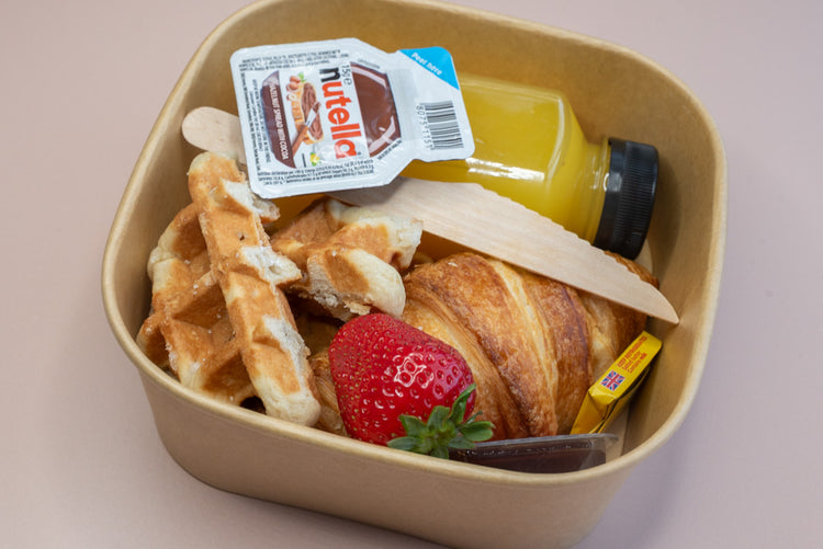 Individual brunch box with croissant, waffle, Nutella, and orange juice – breakfast catering delivery Manchester