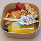 Individual brunch box with croissant, waffle, Nutella, and orange juice – breakfast catering delivery Manchester