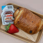 Individual pain au chocolat box with Nutella and strawberry – breakfast catering delivery Manchester
