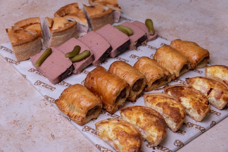 Savoury catering platter with pork pie pate sausage rolls and Quiche Lorraine
