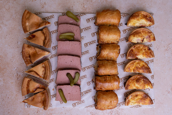 Ready to serve pork pie sausage roll pate and quiche platter for corporate catering
