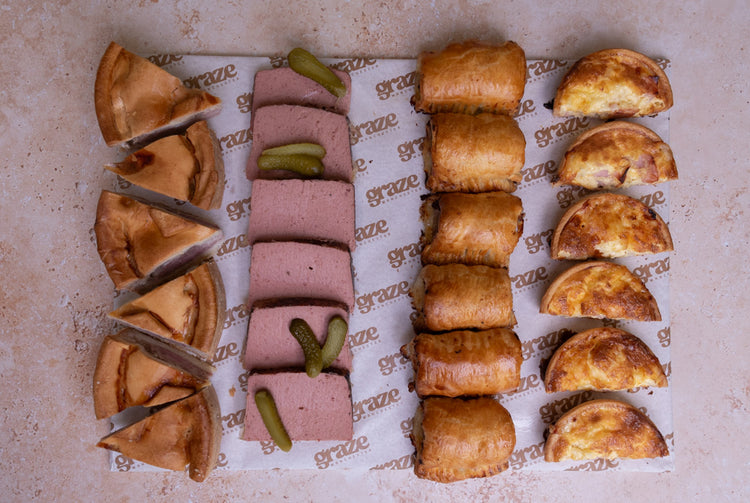 Ready to serve pork pie sausage roll pate and quiche platter for corporate catering
