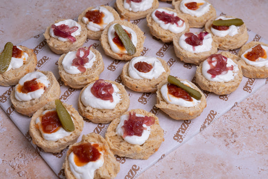 Topped cheese scone platter with whipped feta and homemade chutneys by Graze Manchester