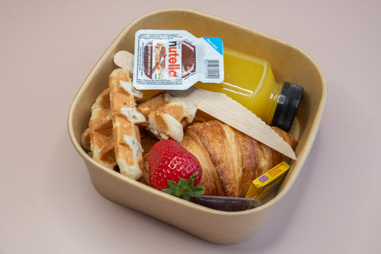 Individual brunch box with croissant, waffle, Nutella, and orange juice – breakfast catering delivery Manchester